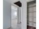 Hallway leading to bedroom and closet, featuring light blue walls and light grey wood-look flooring at 218 S Bruce St, Las Vegas, NV 89101