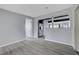 Open floor plan living room with gray wood flooring and a view into the updated kitchen at 218 S Bruce St, Las Vegas, NV 89101