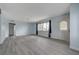 Bright living room with light blue walls and wood-look floors at 218 S Bruce St, Las Vegas, NV 89101