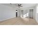Minimalist bedroom with a ceiling fan, closet, and neutral decor at 2368 Winterwood Blvd, Las Vegas, NV 89142