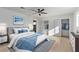 Bright bedroom offers a ceiling fan, a large window, and a closet with sliding doors at 2368 Winterwood Blvd, Las Vegas, NV 89142