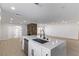 Open-concept kitchen with a large island, perfect for entertaining at 2368 Winterwood Blvd, Las Vegas, NV 89142