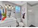 Modern bathroom featuring a vessel sink, framed mirror, and glass-enclosed shower at 2560 Hitchcock St, Henderson, NV 89052