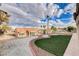 The backyard of this home features desert landscaping, artificial turf, and a low-maintenance design at 3012 Anna Bay Dr, Las Vegas, NV 89134