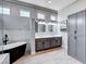 Bright bathroom with modern fixtures, soaking tub, and a double sink vanity offering ample storage at 3012 Anna Bay Dr, Las Vegas, NV 89134
