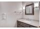 Powder room with gray vanity, stone countertop, and modern fixtures, creating a contemporary aesthetic at 3012 Anna Bay Dr, Las Vegas, NV 89134