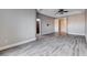 Bright bedroom with sleek wood flooring, neutral paint, and modern ceiling fan, offering a serene retreat at 3012 Anna Bay Dr, Las Vegas, NV 89134