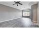 Bright bedroom with sleek wood flooring, neutral paint, and modern ceiling fan, offering a serene retreat at 3012 Anna Bay Dr, Las Vegas, NV 89134