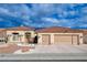 Front exterior view of a well-maintained residence, highlighting the garage and tiled roof at 3012 Anna Bay Dr, Las Vegas, NV 89134