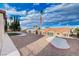 Exterior image of the residence showcasing landscaping and backyard of neighboring homes at 3012 Anna Bay Dr, Las Vegas, NV 89134