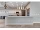 Modern kitchen with white cabinets, stainless steel appliances, and a large center island at 3012 Anna Bay Dr, Las Vegas, NV 89134