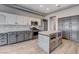 Well-equipped kitchen with island, stainless appliances, stone counters, and custom cabinets at 3012 Anna Bay Dr, Las Vegas, NV 89134