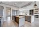 Open-concept kitchen and living room area with a butcher block island and stainless appliances at 3012 Anna Bay Dr, Las Vegas, NV 89134
