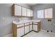 Functional laundry room with upper and lower cabinets, countertop, and a sink at 3012 Anna Bay Dr, Las Vegas, NV 89134
