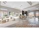 Open-concept living room with high ceilings, hardwood floors, and plenty of natural light at 3012 Anna Bay Dr, Las Vegas, NV 89134