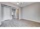 Bright living room featuring wood floors, modern lighting, and neutral paint, creating a stylish, airy space at 3012 Anna Bay Dr, Las Vegas, NV 89134