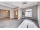 Inviting living room featuring elegant hardwood floors, large windows, and modern lighting at 3012 Anna Bay Dr, Las Vegas, NV 89134