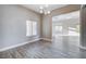 Bright living room featuring wood floors, modern lighting, and neutral paint, creating a stylish, airy space at 3012 Anna Bay Dr, Las Vegas, NV 89134