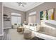 Bright living room with a vaulted ceiling, neutral tones, and a comfortable seating area at 3012 Anna Bay Dr, Las Vegas, NV 89134