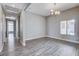 Bright living room featuring wood floors, modern lighting, and neutral paint, creating a stylish, airy space at 3012 Anna Bay Dr, Las Vegas, NV 89134