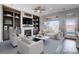 Inviting living room features custom built-ins, a fireplace, and large windows with a view at 3012 Anna Bay Dr, Las Vegas, NV 89134