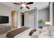 Staged main bedroom featuring a king bed, side table, modern ceiling fan, and closet at 3012 Anna Bay Dr, Las Vegas, NV 89134