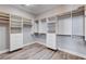 Spacious walk-in closet with custom shelves, drawers, and hanging rods to organize wardrobe at 3012 Anna Bay Dr, Las Vegas, NV 89134