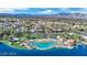 A beautiful aerial view of a lakeside community and artificial beach, enhanced by scenic mountain views at 3109 Siena Cir, Las Vegas, NV 89128