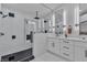 Modern bathroom featuring a glass enclosed shower with dual shower heads and dual vanity at 3109 Siena Cir, Las Vegas, NV 89128