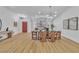 Well lit dining room with modern wood table and chairs at 3109 Siena Cir, Las Vegas, NV 89128