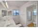 Bright bathroom featuring double sinks, and a bathtub with a shower at 3152 Centavo Dr, Las Vegas, NV 89117