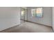 Bright, carpeted bedroom with mirrored closet doors and ample sunlight from a window at 3152 Centavo Dr, Las Vegas, NV 89117