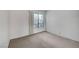 Bedroom with carpet flooring, and a large window offering natural light at 3152 Centavo Dr, Las Vegas, NV 89117