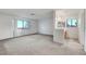 Large bedroom with carpet and a large window, adjacent to an ensuite bathroom at 3152 Centavo Dr, Las Vegas, NV 89117