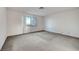 Neutral-toned bedroom with a large window offering natural light and views at 3152 Centavo Dr, Las Vegas, NV 89117