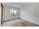 Spacious bedroom with neutral carpet and a large window provides ample natural light at 3152 Centavo Dr, Las Vegas, NV 89117