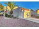 Charming home featuring an attached garage, desert landscaping, and a mature palm tree in the front yard at 3152 Centavo Dr, Las Vegas, NV 89117