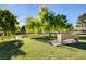 Park-like setting with shade trees, green space, pond and walking paths at 3152 Centavo Dr, Las Vegas, NV 89117