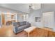 Spacious living room featuring wood floors, neutral paint, a comfortable sofa, and lots of natural light at 3152 Centavo Dr, Las Vegas, NV 89117