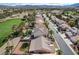 Picturesque aerial of houses, a golf course, palm trees, and a serene environment, perfect for tranquil living at 33 Chateau Whistler Ct, Las Vegas, NV 89148