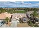 Stunning single-story home nestled in a golf course community with palm trees and mountain views at 33 Chateau Whistler Ct, Las Vegas, NV 89148
