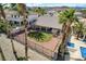 Backyard aerial features a tidy yard, garden, pool, complemented by palm trees and neighborhood views at 33 Chateau Whistler Ct, Las Vegas, NV 89148