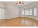 Primary bedroom featuring hardwood floors, neutral walls, and plantation shutters at 33 Chateau Whistler Ct, Las Vegas, NV 89148