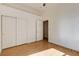 Bright bedroom with hardwood floors, closet, and ceiling fan at 33 Chateau Whistler Ct, Las Vegas, NV 89148