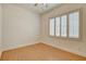 Bright bedroom features wood floors, plantation shutters, and neutral paint at 33 Chateau Whistler Ct, Las Vegas, NV 89148
