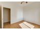Simple bedroom with natural light, hardwood floors, and closet at 33 Chateau Whistler Ct, Las Vegas, NV 89148