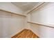 Walk-in closet with wooden floors and shelves at 33 Chateau Whistler Ct, Las Vegas, NV 89148