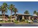 Exterior of the Rhodes Ranch clubhouse with desert landscaping and parking at 33 Chateau Whistler Ct, Las Vegas, NV 89148