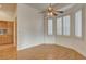 Cozy dining area featuring hardwood floors, shuttered windows, and a ceiling fan at 33 Chateau Whistler Ct, Las Vegas, NV 89148