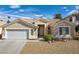 Charming single-story home featuring desert landscaping and a two-car garage at 33 Chateau Whistler Ct, Las Vegas, NV 89148